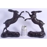 A PAIR OF CONTEMPORARY BOXING HARES. 32 cm x 18 cm.