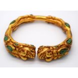 A Chinese yellow metal dragon bracelet inlaid with turquoise stones 7.5 x 6.5cm