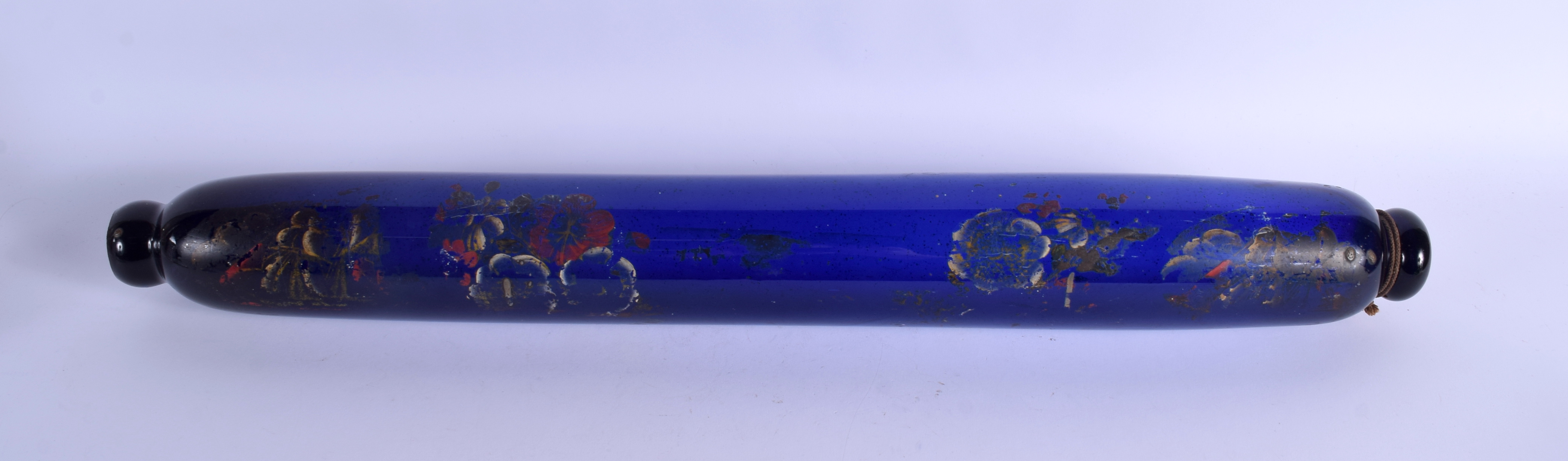 A LONG ANTIQUE BRISTOL BLUE ROLLING PIN painted with flowers. 68 cm long.