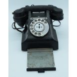 A vintage Bakelite telephone.