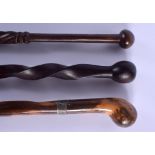 AN ANTIQUE WALKING CANE and two others. 95 cm long. (3)