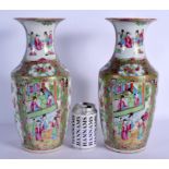 A LARGE PAIR OF 19TH CENTURY CHINESE CANTON FAMILLE ROSE VASES Qing, painted with figures and landsc