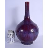 A CHINESE FLAMBE PORCELAIN VASE 20th Century, of bulbous form. 36 cm high.