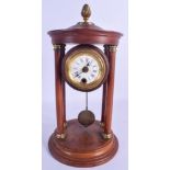 AN ANTIQUE MAHOGANY MANTEL CLOCK of architectural form, with visible pendulum. 30 cm x 12 cm.