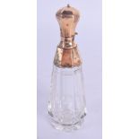 AN 18CT GOLD MOUNTED GLASS SCENT BOTTLE. 9 cm high.