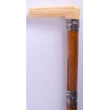 A VICTORIAN SILVER MOUNTED IVORY SWORD STICK. 82 cm long.