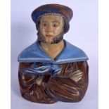 AN ANTIQUE AUSTRIAN TOBACCO JAR AND COVER in the form of a cross armed sailor. 24 cm high.