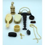 A collection of Ivory items including sculptures , brushes napkin and necklace Qty.