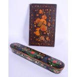 A 19TH CENTURY ISLAMIC MIDDLE EASTERN LACQUER SLIDING PEN BOX together with a Qajar book cover. Larg