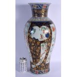 A RARE LARGE 18TH CENTURY JAPANESE EDO PERIOD IMARI BALUSTER VASE painted with buildings and landsca