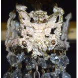 A 5 tier crystal glass chandelier with a cage of crystal and Cherubs 56 x 21cm