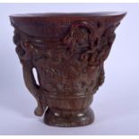 A CHINESE CARVED BUFFALO HORN LIBATION CUP 20th Century. 13 cm x 13 cm.