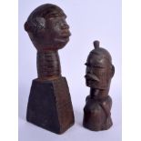 TWO AFRICAN TRIBAL CARVED SCARIFIED HARDWOOD BUSTS incised with motifs. Largest 25 cm high. (2)