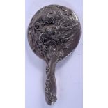 A 19TH CENTURY JAPANESE MEIJI PERIOD HAMMERED SILVER HAND MIRROR overlaid with a dragon. 26 cm x 14