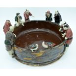 A large Japanese Sumida Gawa pottery bowl with figures peering into the bowl 38 x 18cm.