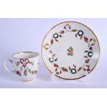 18th c. Bristol teacup and saucer painted with wreathes and a looped line, gilt 7 or 1 to each with