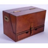 A EUROPEAN LEATHER STATIONARY BOX with brass handles. 38 cm x 20 cm.