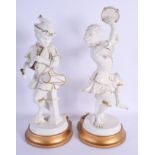 A LARGE PAIR OF CONTINENTAL PORCELAIN FIGURES OF MONKEY MUSICIANS modelled upon gilt bases. 42 cm hi