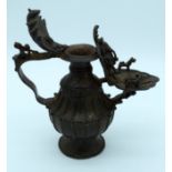 A Chinese Tibetan bronze water jug 27cm x 29cm.