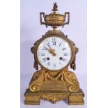 A LARGE 19TH CENTURY FRENCH BRONZE MANTEL CLOCK with bold lion mask head handles, overlaid in acanth