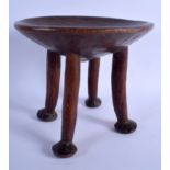 A LOVELY EARLY 20TH CENTURY AFRICAN TRIBAL FOUR FOOTED STOOL with animal like feet. 25 cm x 23 cm.