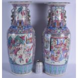 A LARGE PAIR OF 19TH CENTURY CHINESE CANTON FAMILLE ROSE STRAITS PORCELAIN VASES Qing, painted with