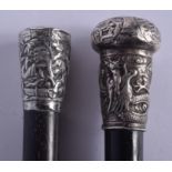 TWO 19TH CENTURY CHINESE EXPORT SILVER AND HARDWOOD CANES. 90 cm long. (2)