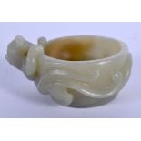 AN EARLY 20TH CENTURY CHINESE CARVED GREEN JADE LIBATION CUP Late Qing. 7 cm x 2 cm.
