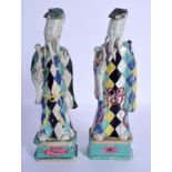 A PAIR OF 18TH CENTURY CHINESE EXPORT HARLEQUIN IMMORTALS Qing, enamelled with motifs. 24.5 cm high.