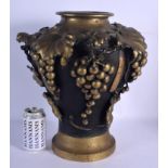 A LARGE 19TH CENTURY JAPANESE MEIJI PERIOD BRONZE VASE overlaid with berries and vines. 38 cm x 28 c