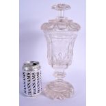 AN EARLY 19TH CENTURY BOHEMIAN CRYSTAL GLASS JAR AND COVER with well cut base. 31 cm high.