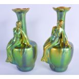 A RARE PAIR OF HUNGARIAN ZSOLNAY PECS PORCELAIN VASES of iridescent form. 24 cm high.