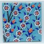 An Islamic floral pattern tile 20 x 20cm .