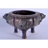 A 19TH CENTURY CHINESE TWIN HANDLED BRONZE CENSER Yongzheng style, decorated in relief with birds an