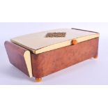 A 1950S BAKELITE MUSICAL JEWELLERY BOX. 24 cm x 12 cm.