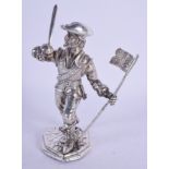 AN UNUSUAL EARLY 20TH CENTURY CONTINENTAL SILVER FIGURE OF A PIRATE modelled holding a flag. 150 gra