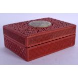 A 19TH CENTURY CHINESE CINNABAR LACQUER BOX AND COVER inset with jade. 13 cm x 9 cm.