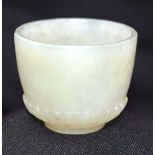 A carved jade cup 4 x 3 cm.
