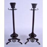 A PAIR OF 19TH CENTURY EUROPEAN GRAND TOUR BRONZE CANDLESTICKS. 30 cm high.