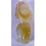 A CHINESE CARVED GREENISH WHITE JADE FIGURE OF A BOY 20th Century. 9 cm high.