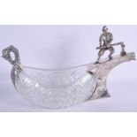 AN UNUSUAL LARGE CONTINENTAL SILVER AND CUT GLASS SERVING BOWL formed as a Nordic male steering a ho