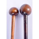 TWO TRIBAL HARDWOOD CLUBS. 71 cm long. (2)