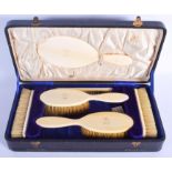AN ANTIQUE IVORY CASED DRESSING TABLE SET. (qty)