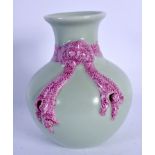 AN EARLY 20TH CENTURY CHINESE PORCELAIN CELADON VASE Late Qing, overlaid with pink ribbons. 11.5 cm