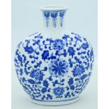 A Chinese ceramic blue and white moon flask 13 x 28 cm.