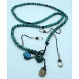 A long Turquoise stone necklace with hanging glass pendants 170cm.