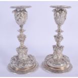 A PAIR OF 19TH CENTURY SILVER PLATED CANDLESTICKS Attributed to Elkington & Co. 16.5 cm high. 1204 g