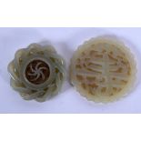 TWO EARLY 20TH CENTURY CHINESE CARVED JADE PLAQUES Late Qing. 5 cm diameter. (2)