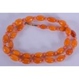 AN ART DECO CORAL AND AMBER NECKLACE. 17 grams. 40 cm long.