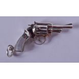 A SILVER PISTOL PENDANT. 17 grams. 5.5 cm wide.